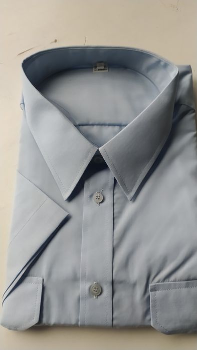 Koszula niebieska krótki rękaw z pagonami Policja