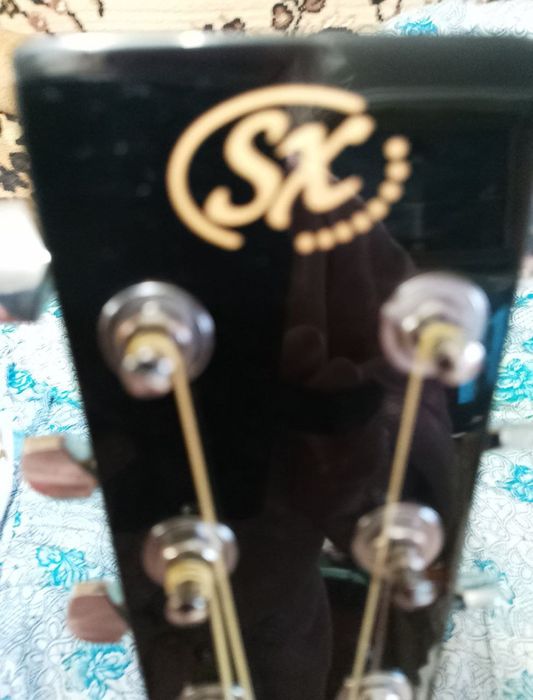 Продам новую акустическую гитару SX