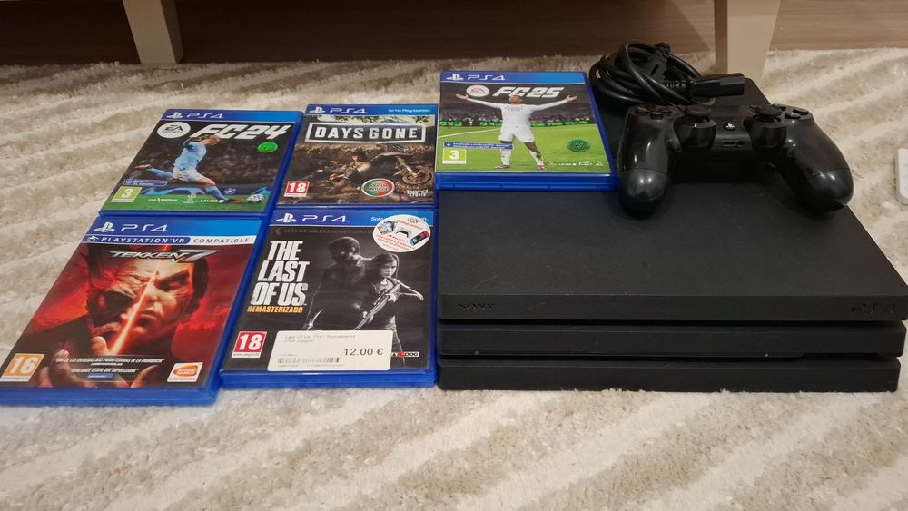 PLAYSTATION 4 PRO  1 comando 6 jogos tem mais um jogo guardado