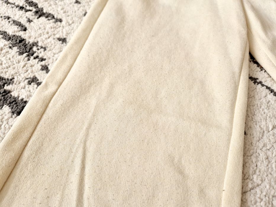 Kremowe spodnie Sinsay XS 34 spodenki dresy