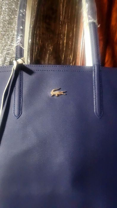 Bolsas lacoste a 60% novas com saco de embrulho