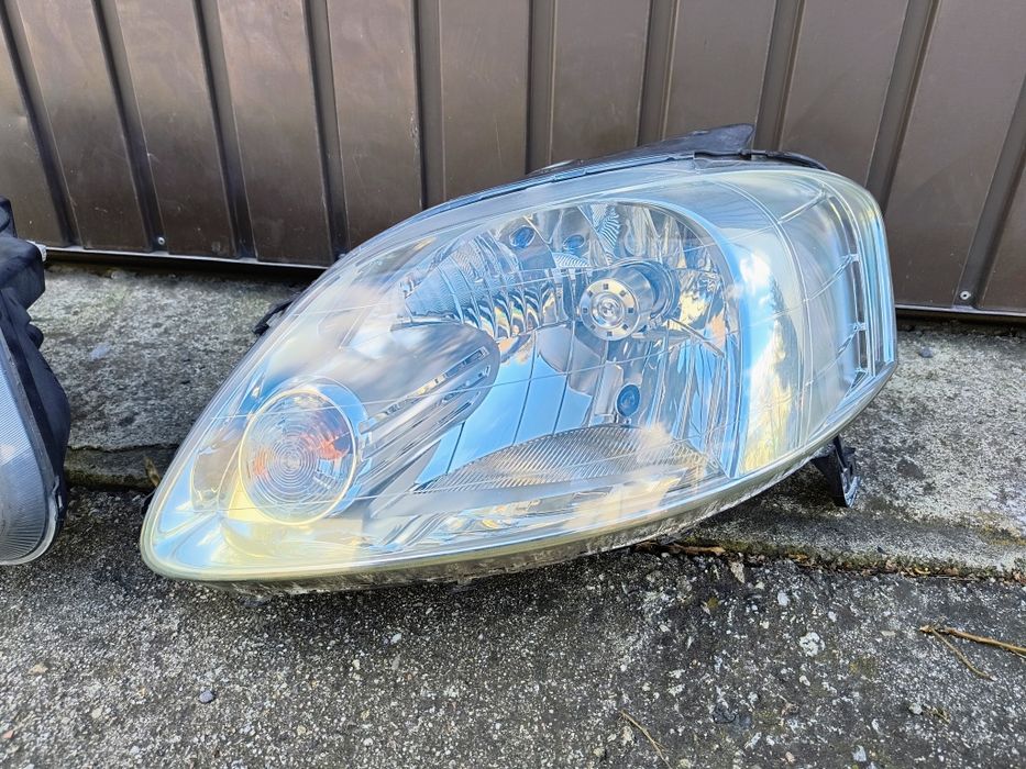 Vw Fox - Reflektor lewy kpl. Oryginał EUR.