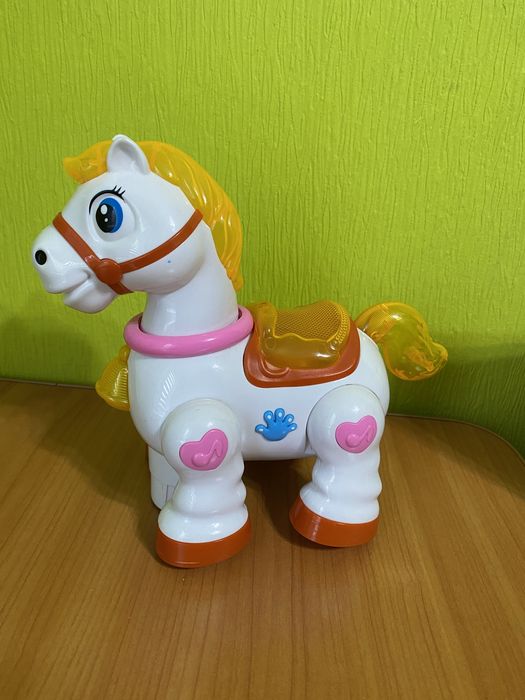 Музичний коник. Конячка що їздить. Кінь