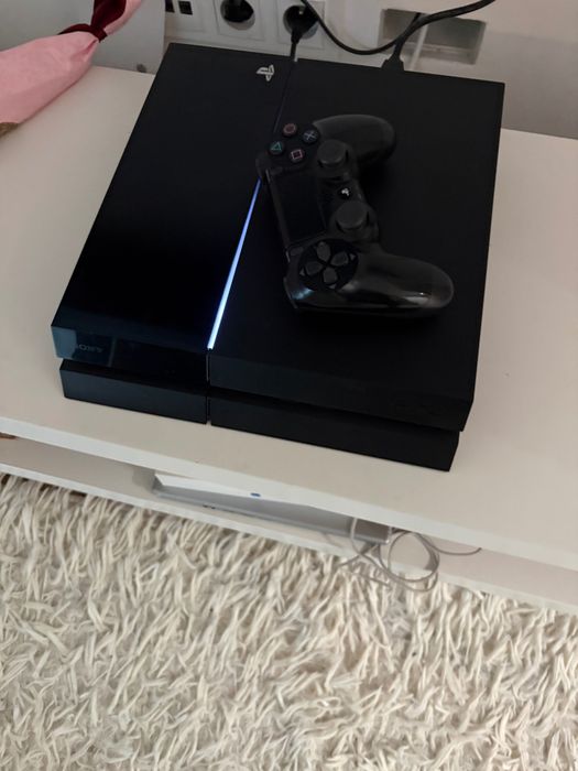 Play station 4 for sale used but in good condition, comes with 2 games and 1 pad with all cables