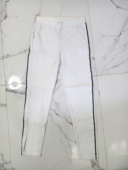 Nowe białe spodnie leggingsy z lampasami w pasie na gumie S