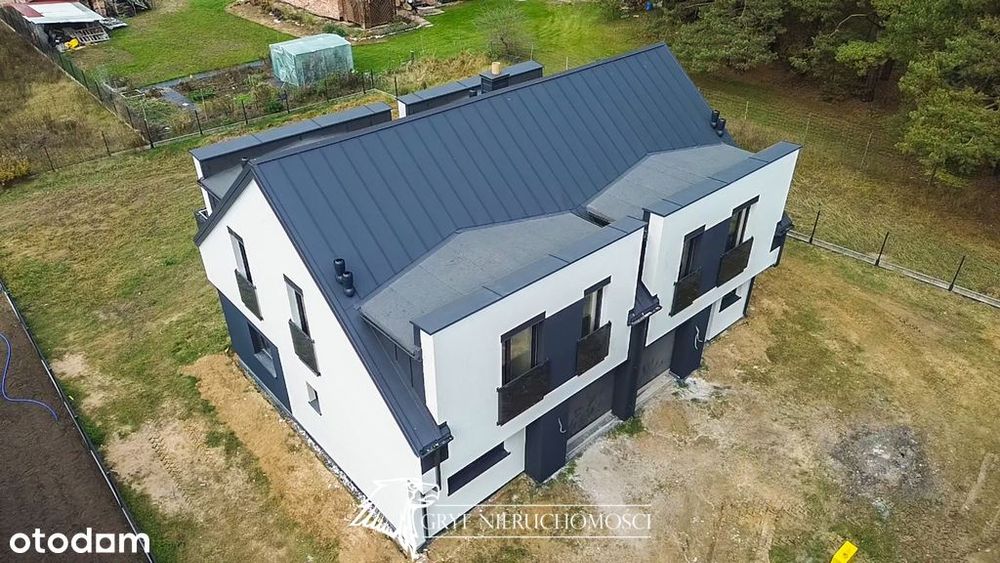 - Przestronny dom wolnostojący z 2 garażami -