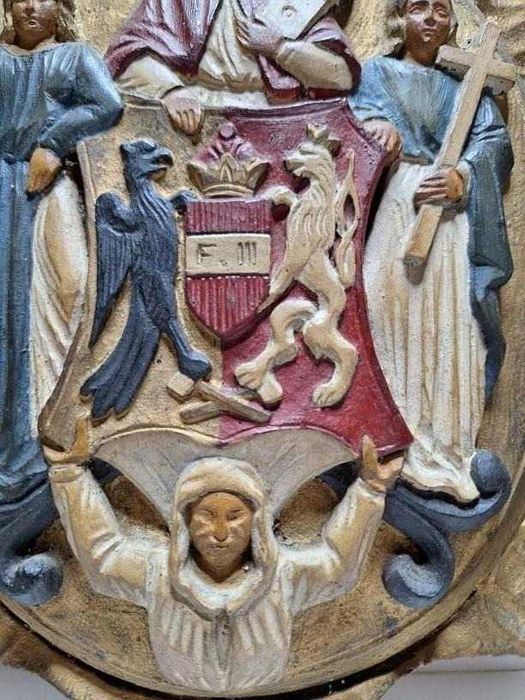 Stary drewniany herb