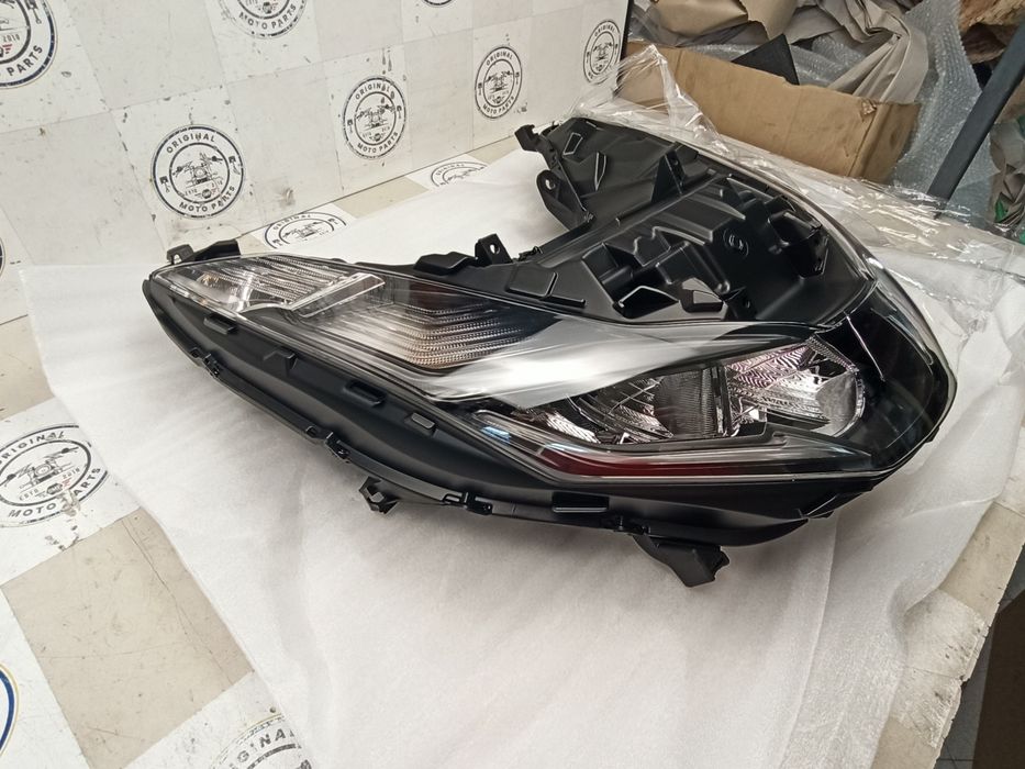 Farol/ ótica Honda PCX Novo