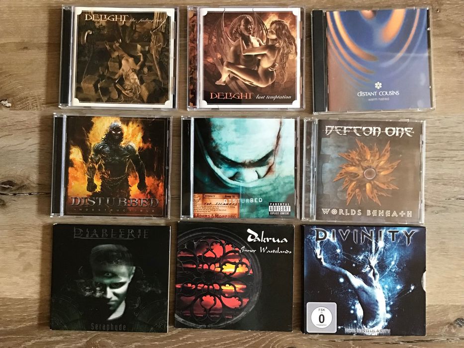 CDs rock metal baratos.    D