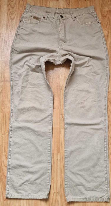 Bezowe spodnie męskie jeans Wrangler Ohio W35L34