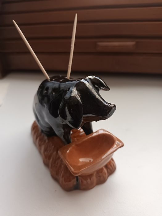 Paliteiro porco no coucho