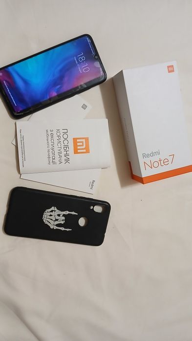 Телефон мобільний.