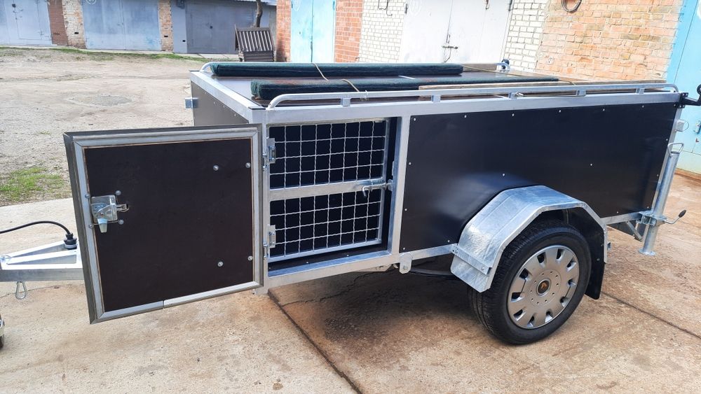 Прицеп , причіп для перевозки собак.