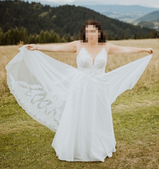 Smietankowa suknia ślubna