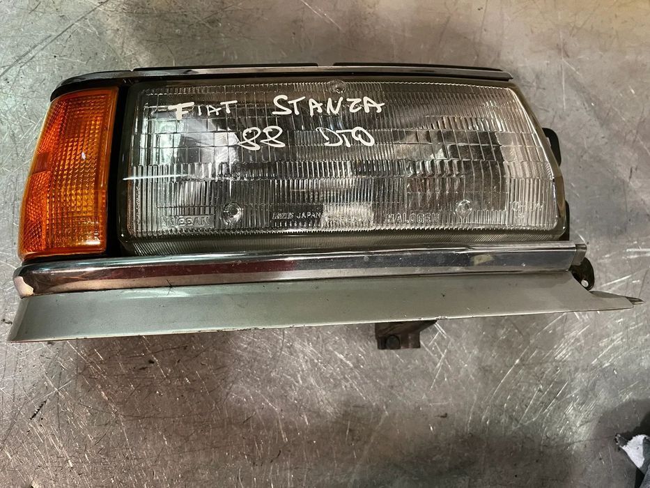 ÓTICA / FAROL NISSAN STANZA - ESQUERDO / DIREITO
