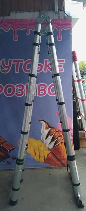 Телескопічна алюмінієва драбина-трансформер 2,5×2,5 м