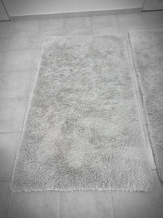 2 tapetes creme de 160x85 cms