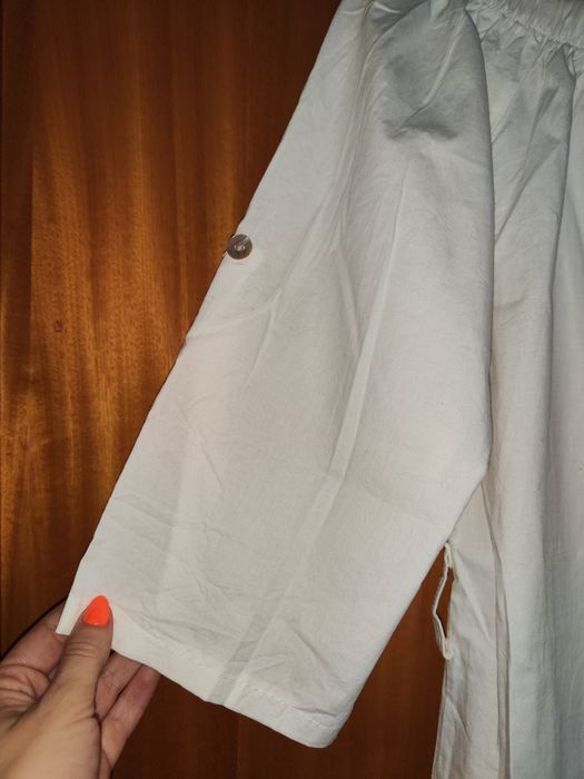 Túnica branca em barco