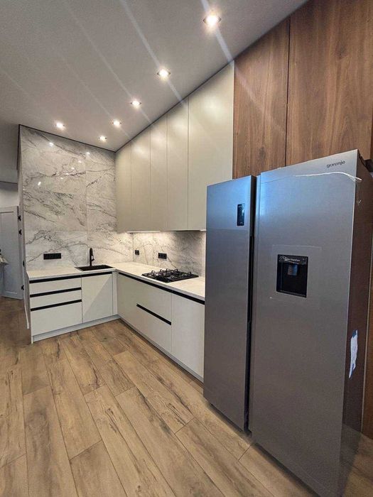 Продам кутовий таунхаус з дизайнерським ремонтом в самому центрі Бучі