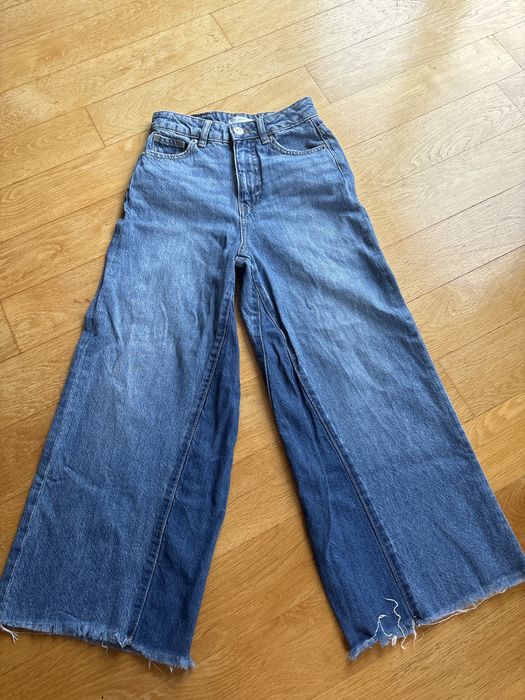 Szerokie jeansy marki MNG