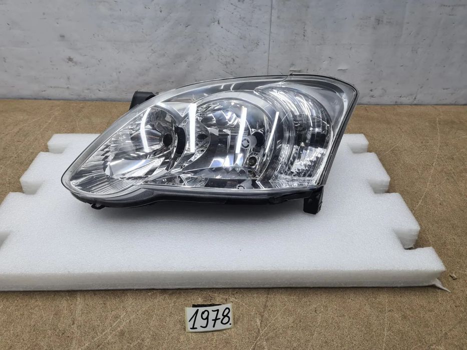 Toyota Corolla E12 04-07r 8117002380 reflektor lampa przednia przód Valeo