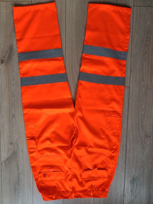 Męskie spodnie robocze pomarańczowe odblaskowe jak nowe Warrior