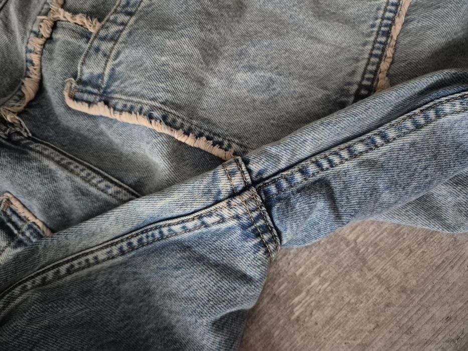 Luźne spodnie jeansy baggy Bershka M