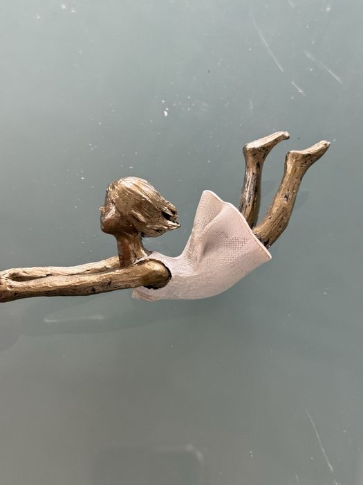 Pequeno objecto decorativo em formato de anjo.