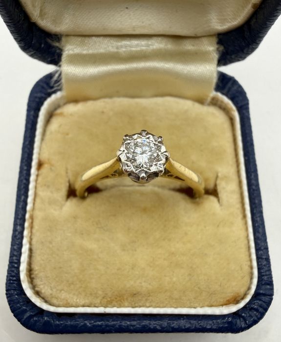 Złoty pierścionek 750 z diamentem 0,15ct