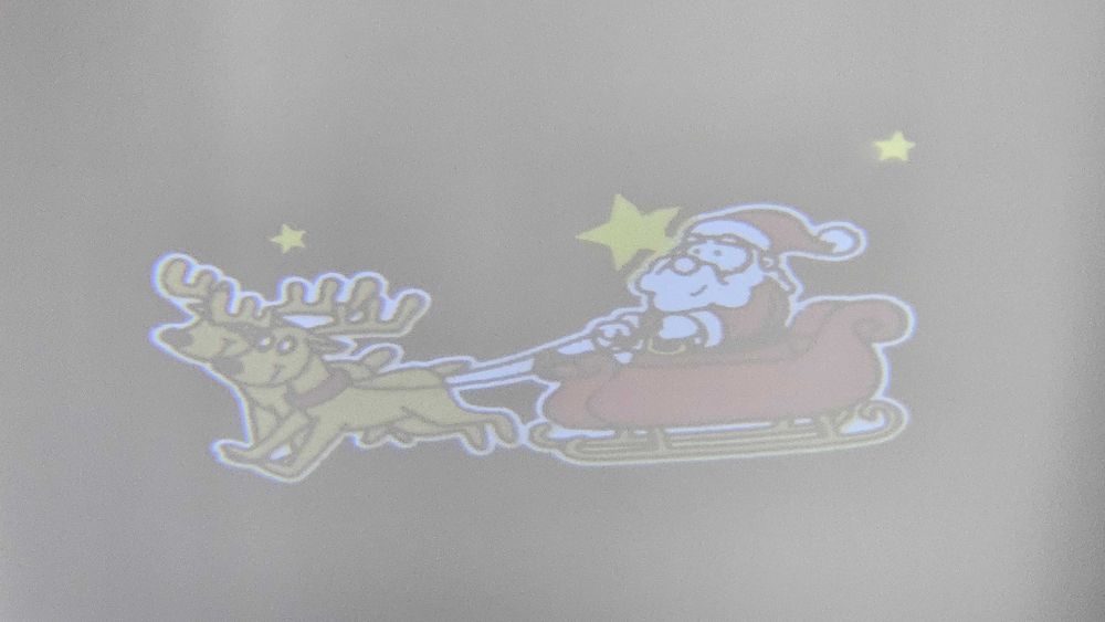Projektor rzutnik LED animowany Święty Mikołaj na sankach