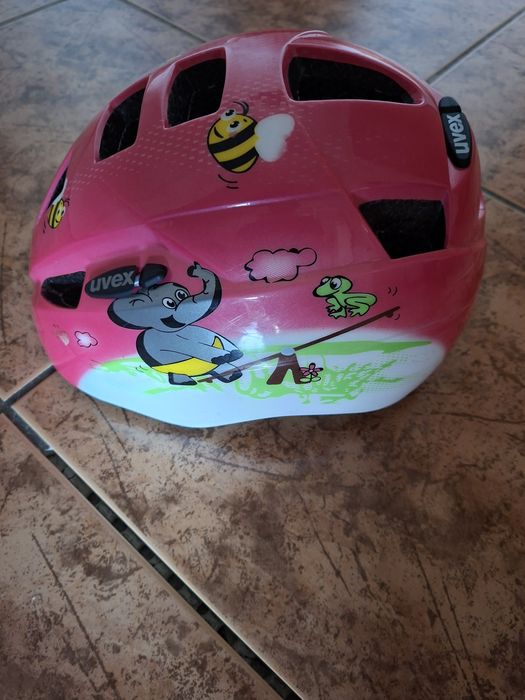 Kask rowerowy dla dziewczynki Uvex wraz z rączką do nauki jazdy