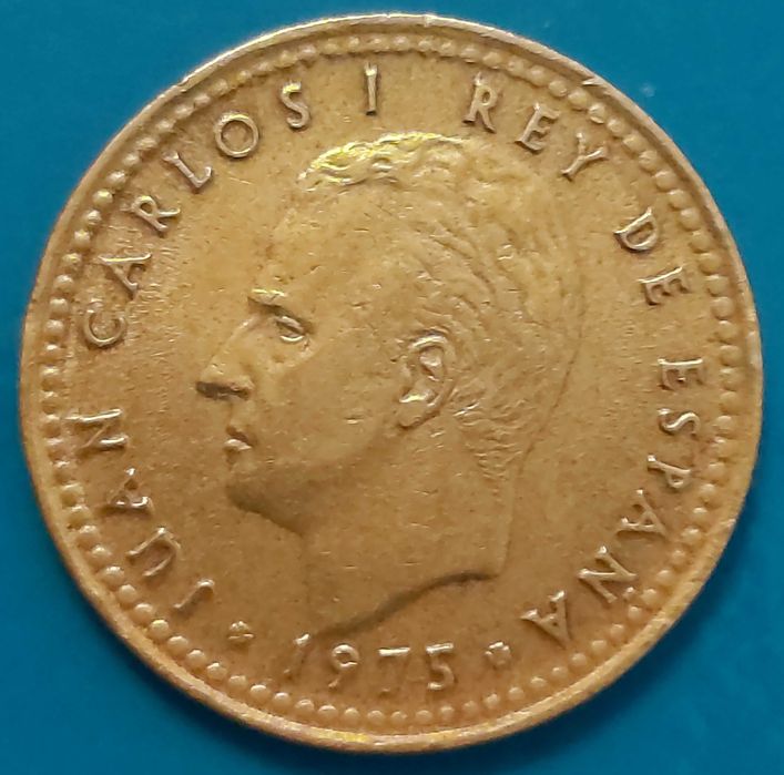 Una Peseta de 1975 com *77* na estrela