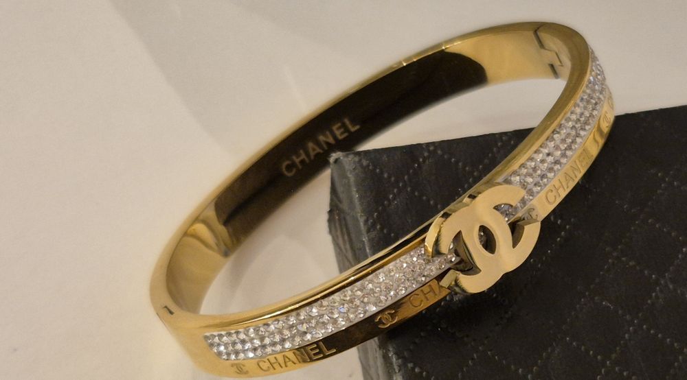 Piękna złota bransoletka cc kryształki napis Cudo lv ysl