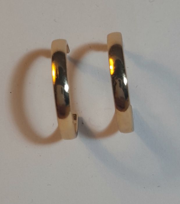 Gold hoop with spike.