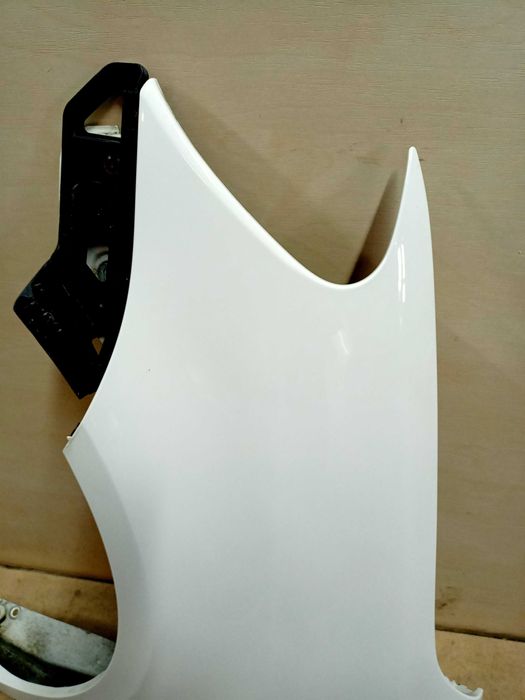 VW Caddy Touran 1 3 lift 2014r. błotnik lewy przód przedni biały