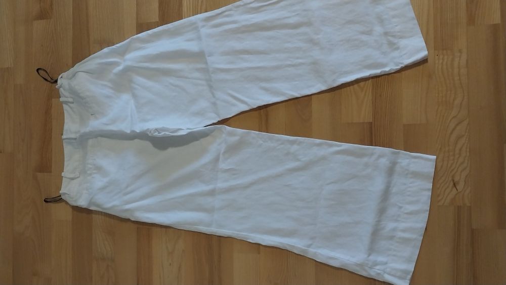 Продам  женские белые льняные штаны  Warehouse  оригинальные.