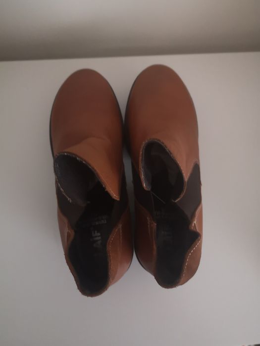 Botas de inverno em pele