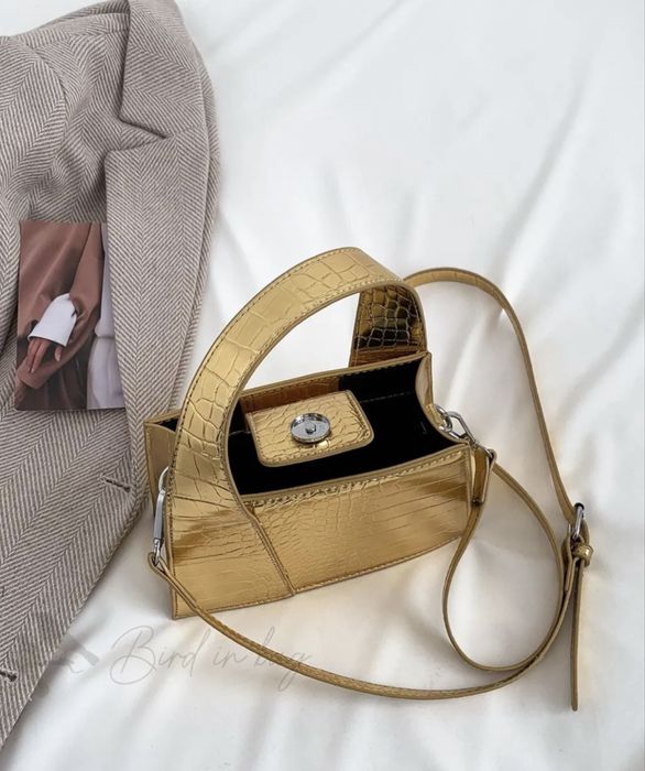 Жіноча золота сумочка