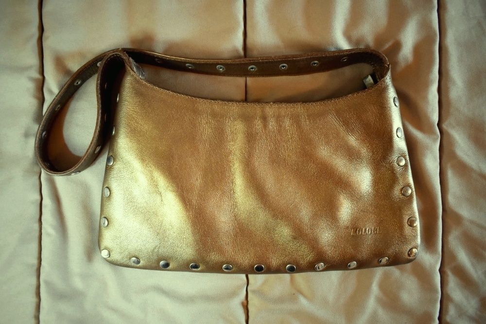 Mala dourada de couro genuíno