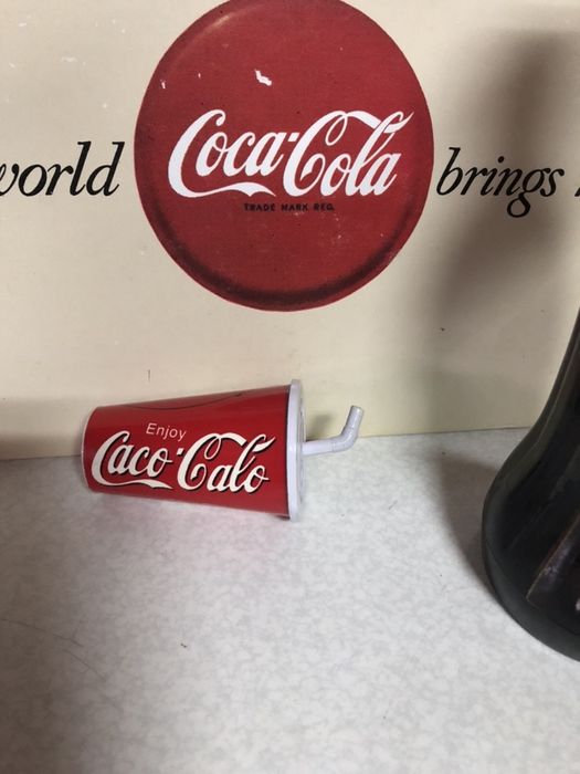 Coca cola. Caco calo. Isqueiro