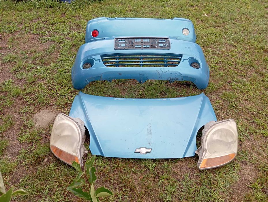 Chevrolet Matiz maska zderzak lampy