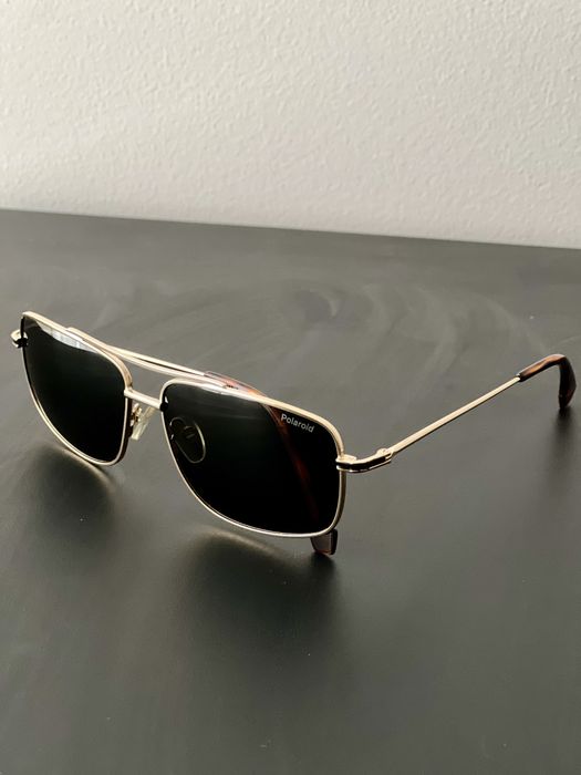 Oculos de sol dourados Polaroid