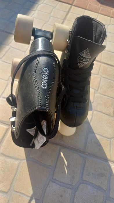 patins pretos rodas 2x2