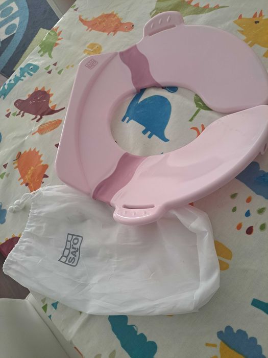 Redutor de viagem cor de rosa Saro