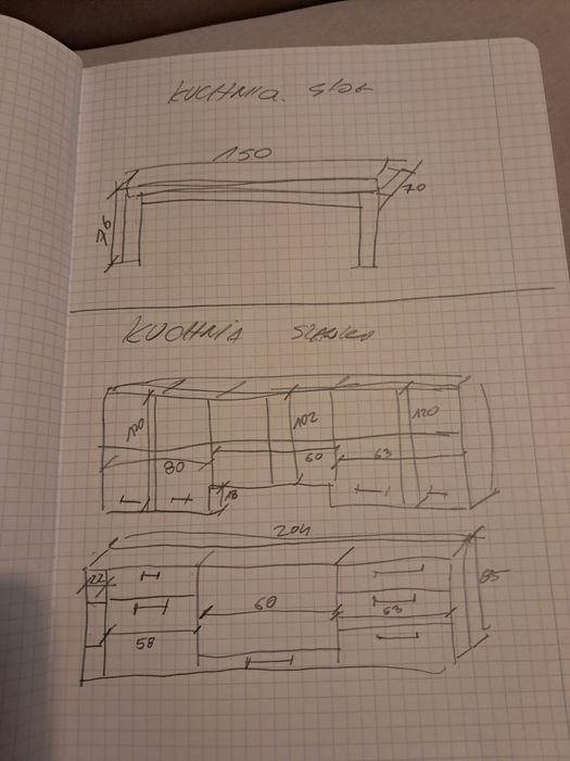 Zabudowa kuchenna ze stołem i sprzętem AGD