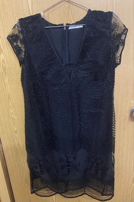 Платя розмір 48.