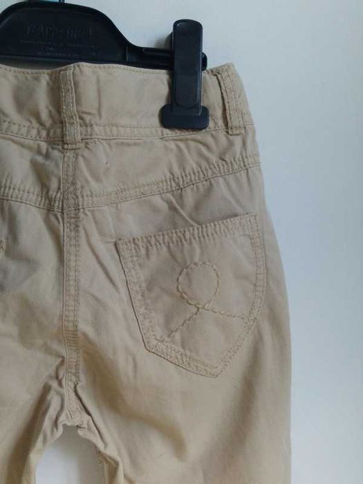 Długie spodnie beżowe lekkie przewiewne wiosenne letnie Next 122 7 lat
