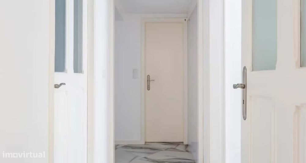 Superior room with shared bathroom and a sofa