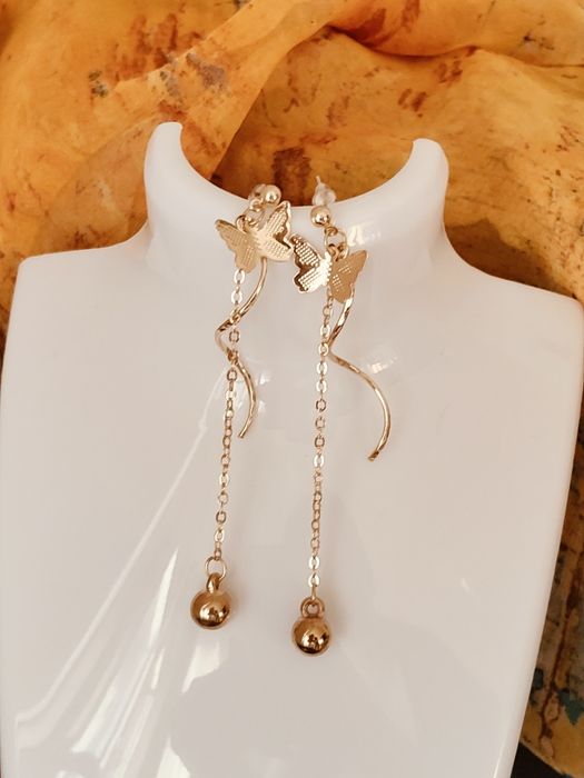 Eleganckie złote długie kolczyki minimalistyczne motyle Glamour