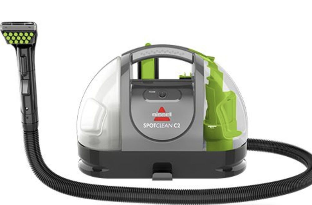 o aspirador de carpetes e estofos